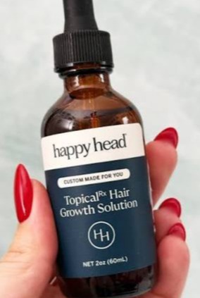 Verified customer Lateisha Clay reviewing Happy Head hair growth